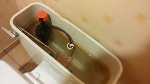 cleaning toilet tank